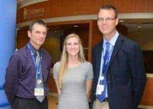 Photo of Madeline Griffith and Two Physicians from Children's Hospital 